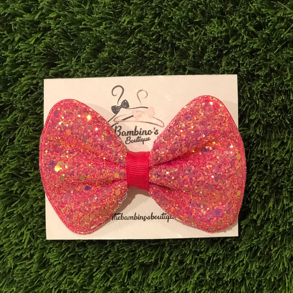 👶🏽 glitter bow
